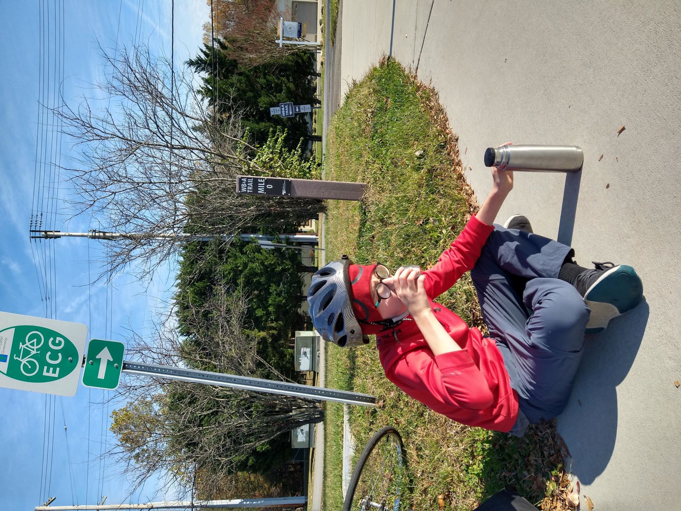 image of sam drinking hot chocolate at mile 0 of WB&A trail 